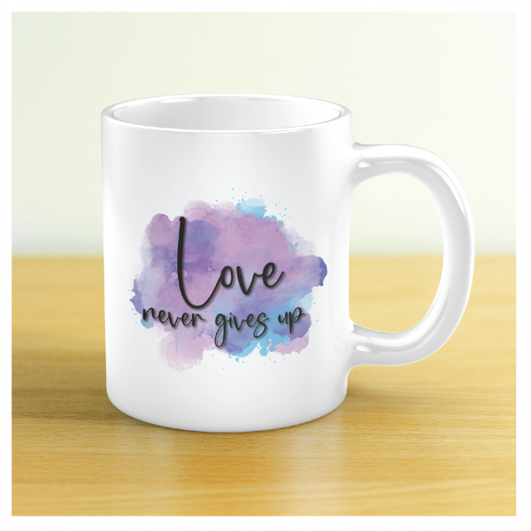 Love never gives up mug